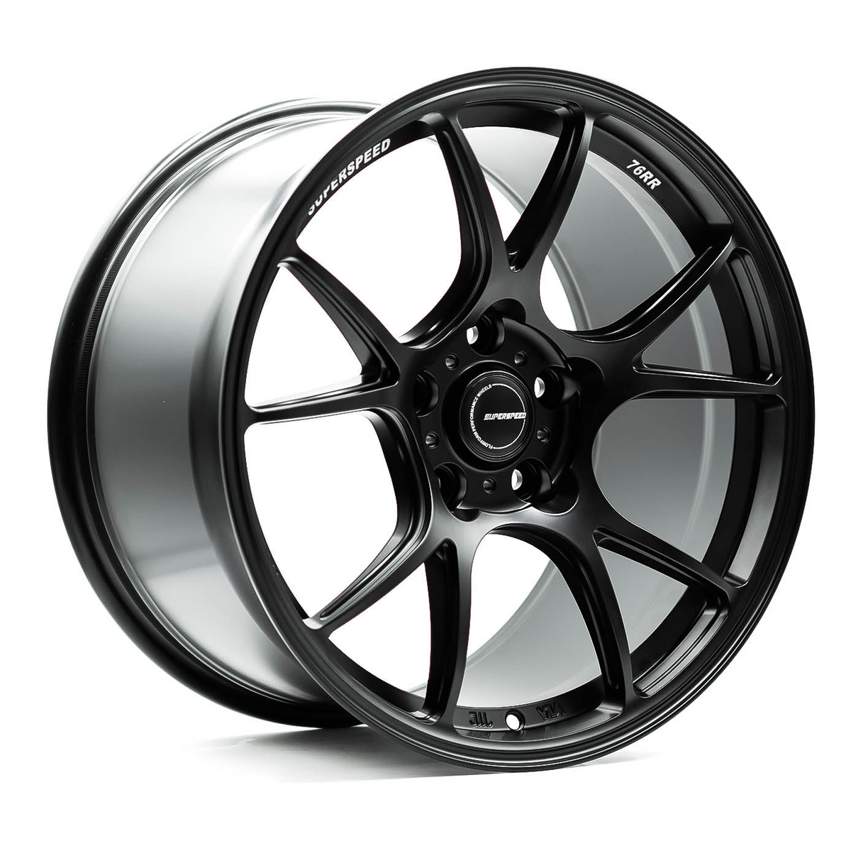 Black alloy wheel with visible branding on a white background