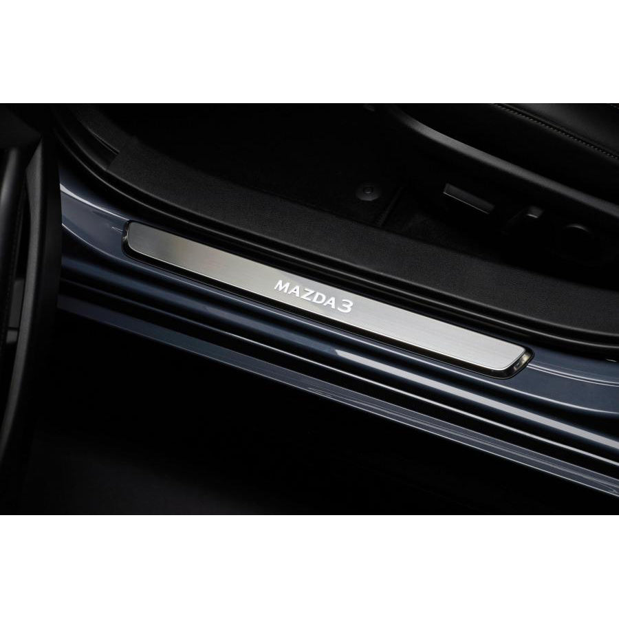 Mazda3 door sill plate on a black car interior